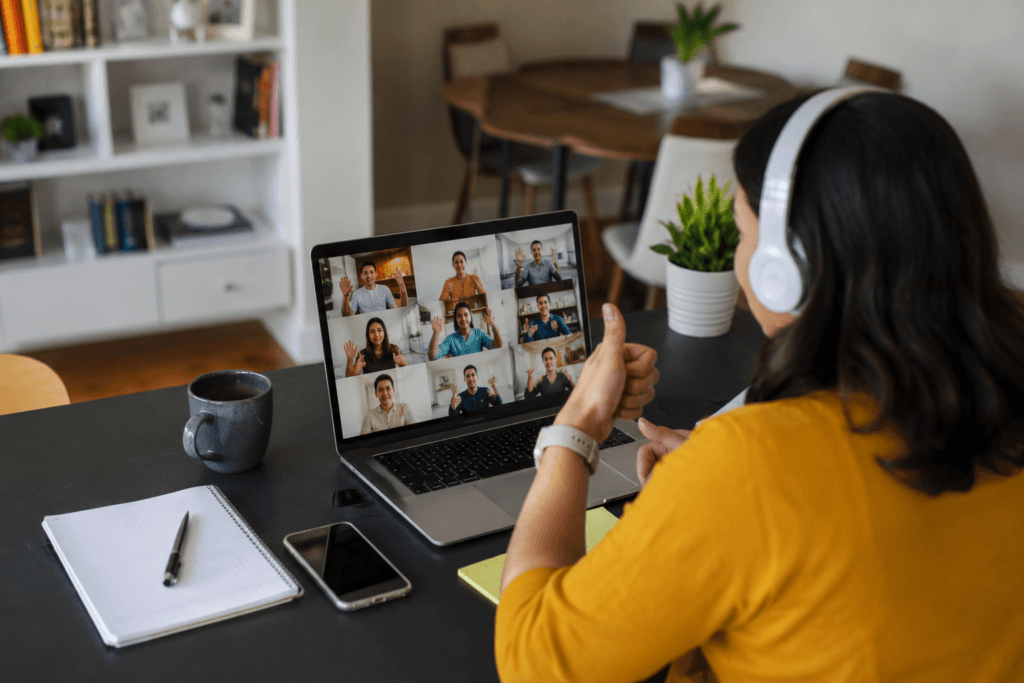 Remote employees participating in a virtual team building activity through an online video meeting to improve collaboration and employee engagement.